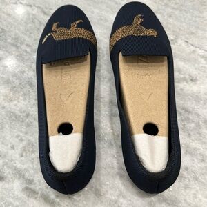 Navy blue flats with cheetah stitching on front.  Brand new, never worn .